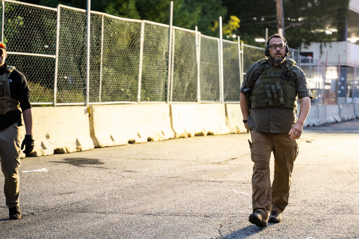 A security guard with Conflict Resolution Group wearing a CRG patch at Seven Points Mall in Uptown Minneapolis.