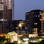 The Legacy Condominiums in downtown Minneapolis. The Eleven tower under construction behind it. July 2021.