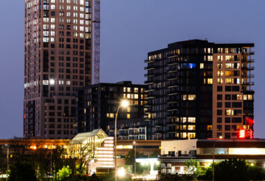 The Legacy Condominiums in downtown Minneapolis. The Eleven tower under construction behind it. July 2021.