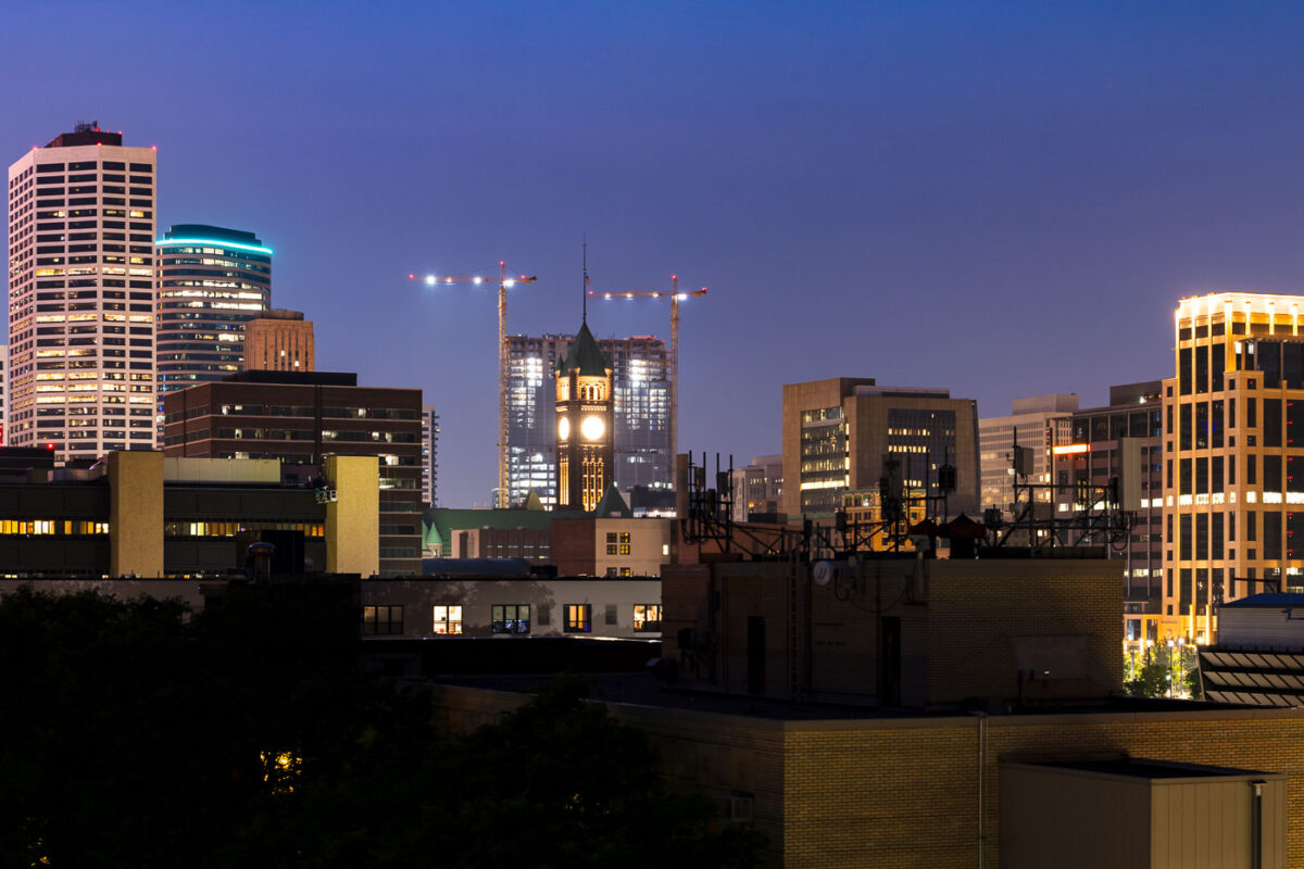 Tower cranes around the gateway project behind Minneapolis City Hall.