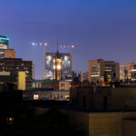 Tower cranes around the gateway project behind Minneapolis City Hall.