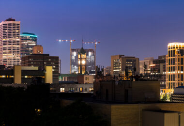 Tower cranes around the gateway project behind Minneapolis City Hall.
