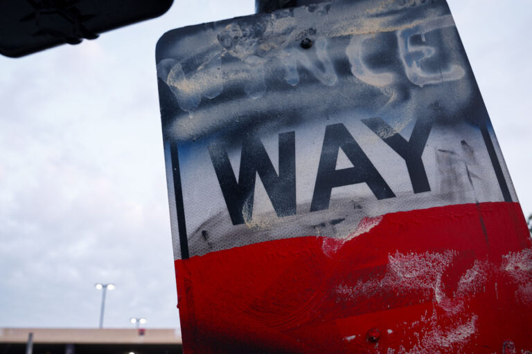 Wince Way sign in Uptown Minneapolis 1 A sign that reads "Wince Way" behind the newly installed security fencing outside the Lake & Girard parking ramp and Wince Marie Garden.