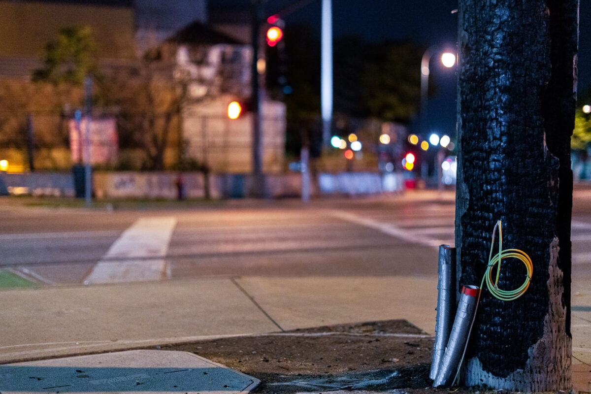 A burned light post across the street from the Minneapolis Police Third Precinct.