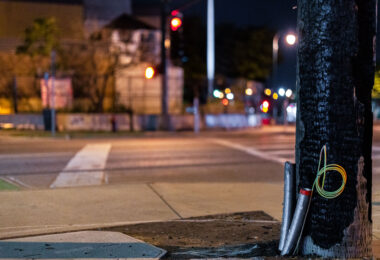A burned light post across the street from the Minneapolis Police Third Precinct.