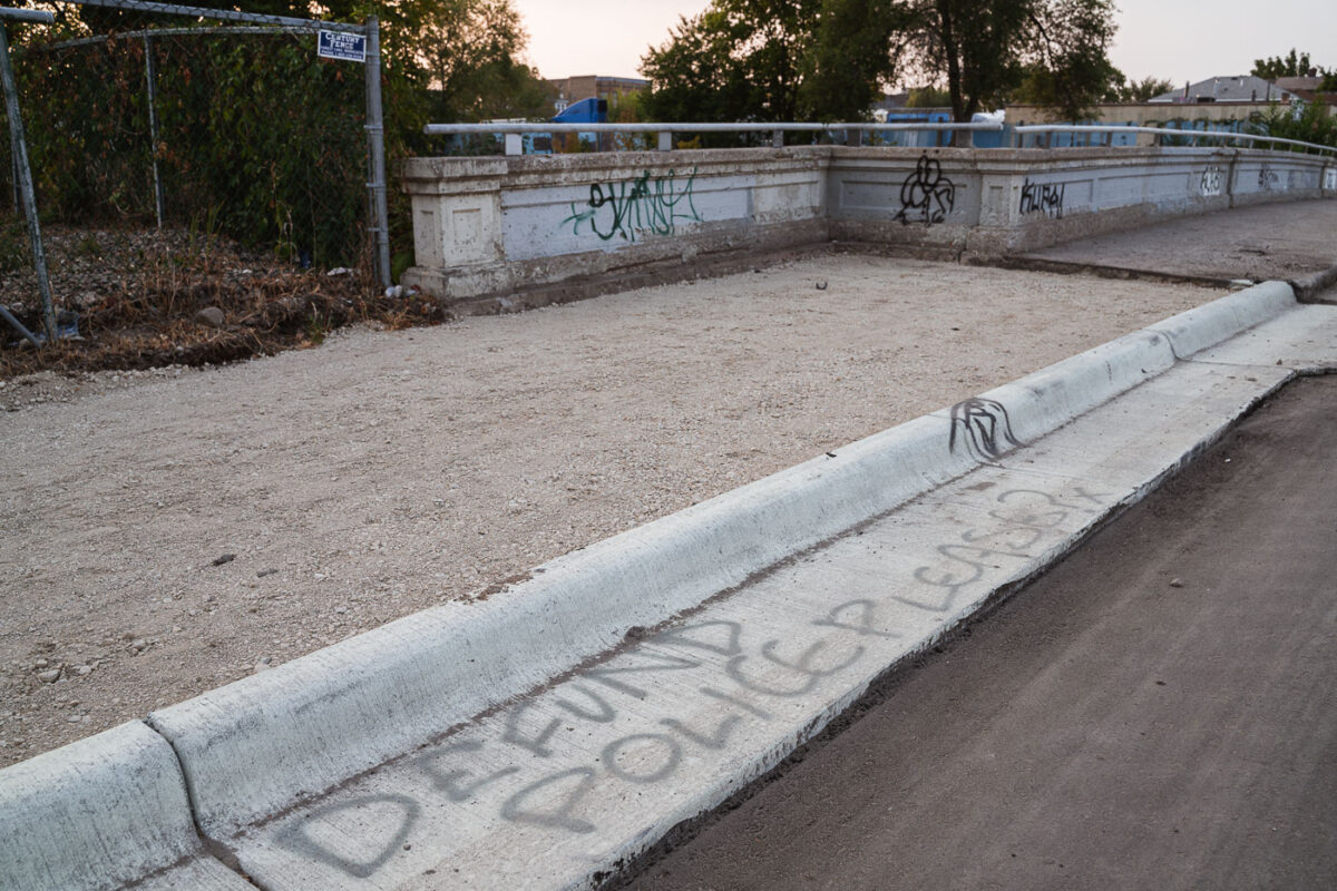 "Defund Police Please?" written on a street curb in South Minneapolis.