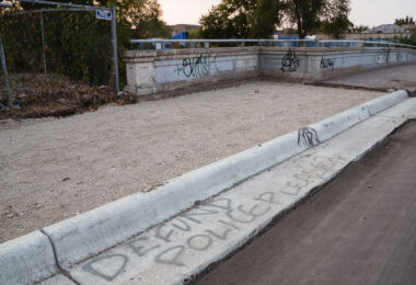 "Defund Police Please?" written on a street curb in South Minneapolis.
