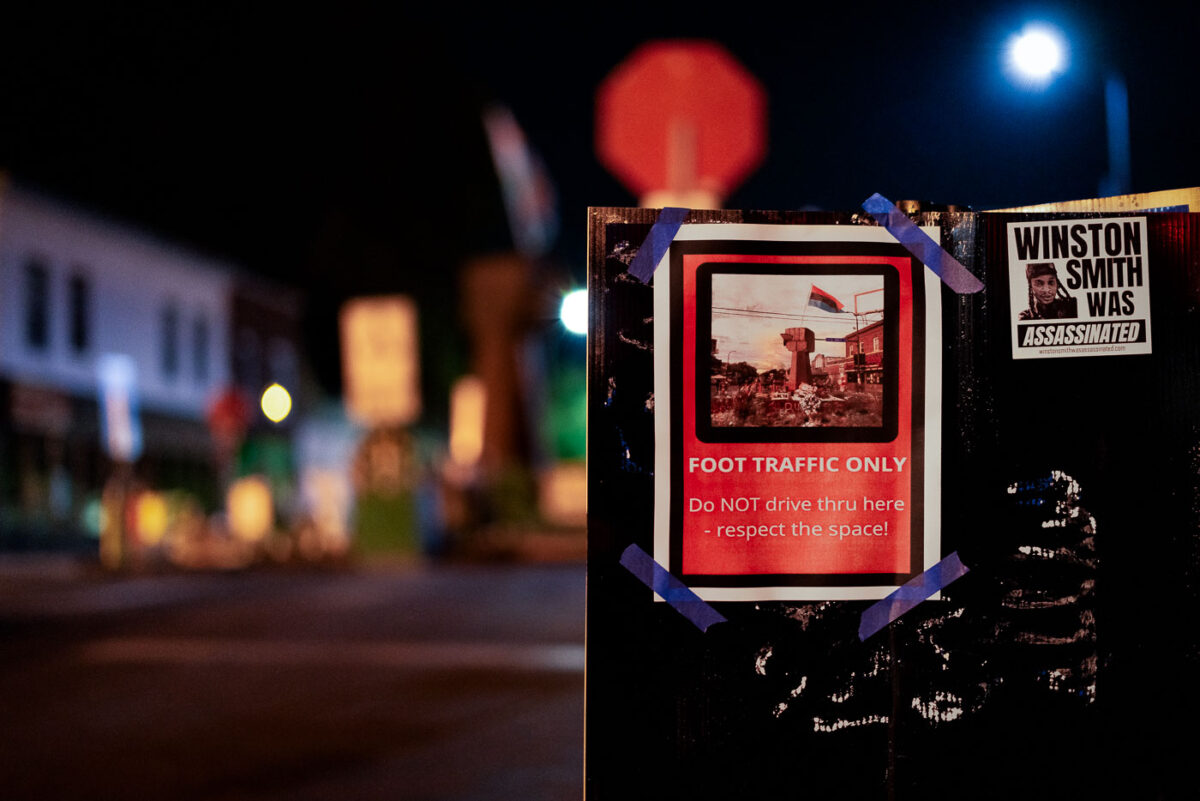 A sign reading "Foot Traffic Only" and "Winston Smith was Assasinated" seen at George Floyd Square in South Minneapolis.