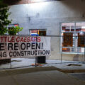 Little Caesars "We're Open" sign. The store was closed after being damaged during unrest.