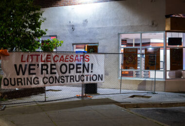 Little Caesars "We're Open" sign. The store was closed after being damaged during unrest.