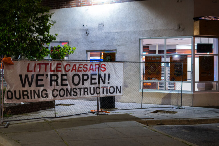 Little Caesars We're Open During Construction 2 Little Caesars "We're Open" sign. The store was closed after being damaged during unrest.