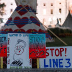 Water is Life Stop Line 3 2 Protesters gathered at the Minnesota State Capitol asking for Governor Walz or President Biden to stop construction on the nearing completion Enbridge Line 3 pipeline in Minnesota.
