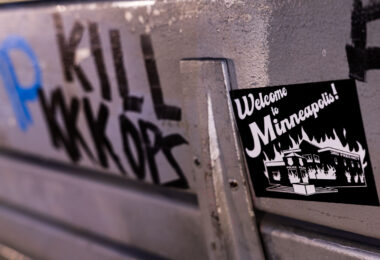 A "Welcome to Minneapolis" sticker on a bench in Minneapolis.