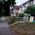 The wooden "Justice For George Floyd" signs sit in front yards of many homes on Park Avenue near George Floyd Square.