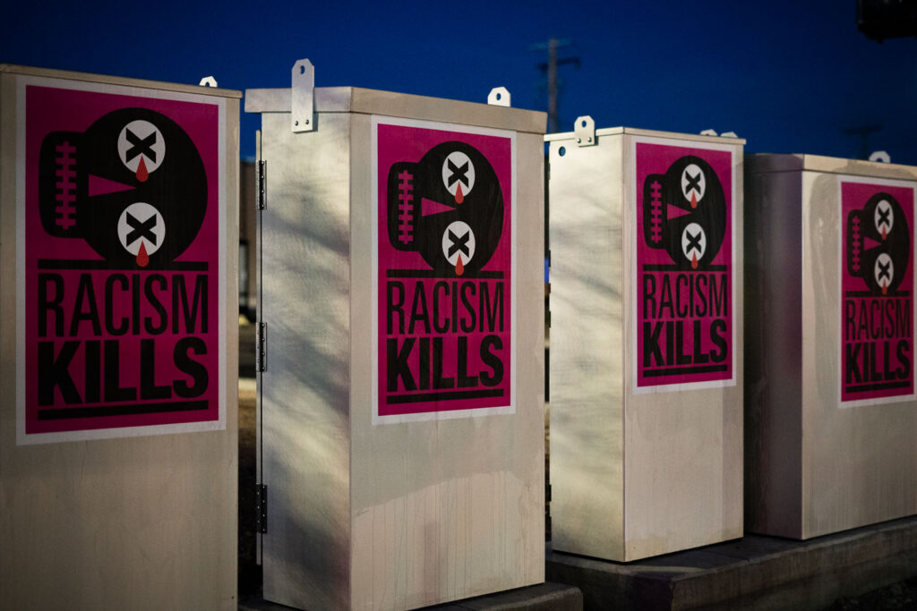 Poster pasted to electrical boxes on the Midtown Greenway in Minneapolis.
