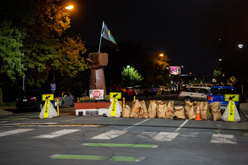 Lawn clipping bags used as barricades after the city cleared out barricades at 39th/Chicago Ave.