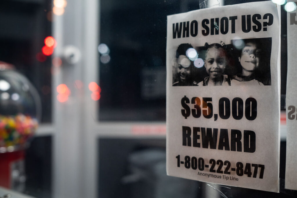 A poster hanging in a storefront asking for help in solving shootings of 3 children during the Spring of 2021 in North Minneapolis. 6-year old Aniya Allen, 9-year old Trinity Ottoson-Smith and 10-year old Ladavionne Garret Jr. Trinity and Aniya died of their injuries.