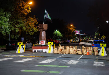 Lawn clipping bags used as barricades after the city cleared out barricades at 39th/Chicago Ave.
