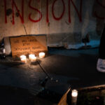 A vigil is held for Winston Smith who was killed by law enforcement 3 months earlier on this day.