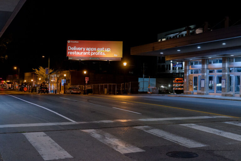 ChowNow Billboard on Hennepin Ave, Uptown Minneapolis at Night 1 A ChowNow billboard on Hennepin Avenue in Uptown Minneapolis states "Delivery apps eat up restaurant profits."
