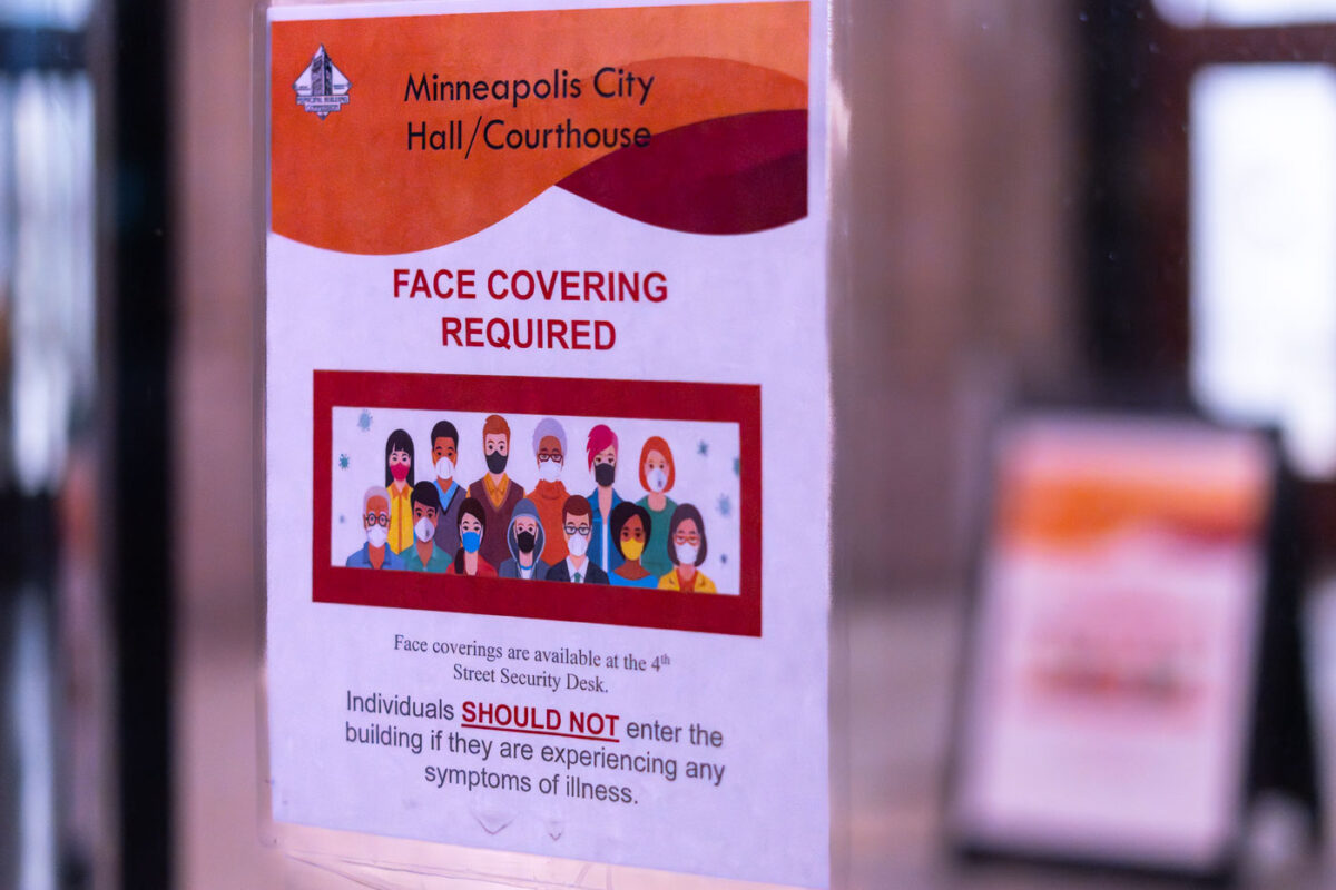 COVID Face Coverings Sign at City Hall