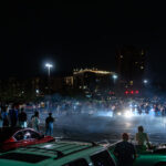 Street racers take over a parking lot near Bde Maka Ska in South Minneapolis.