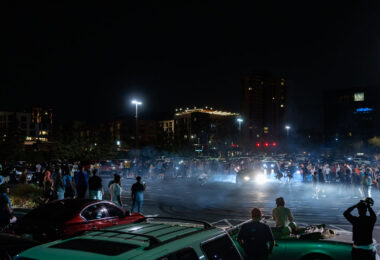 Street racers take over a parking lot near Bde Maka Ska in South Minneapolis.