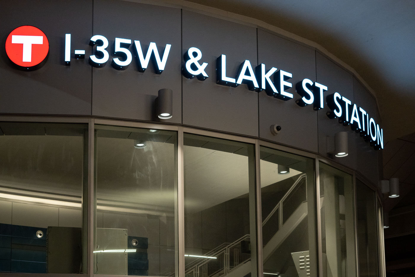 The I-35W & Lake Street Station in Minneapolis, Minnesota, is a transit hub for bus and light rail services, featuring modern illuminated signage.