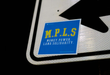 A M.P.L.S. Money Power Land Solidarity sticker found in South Minneapolis.