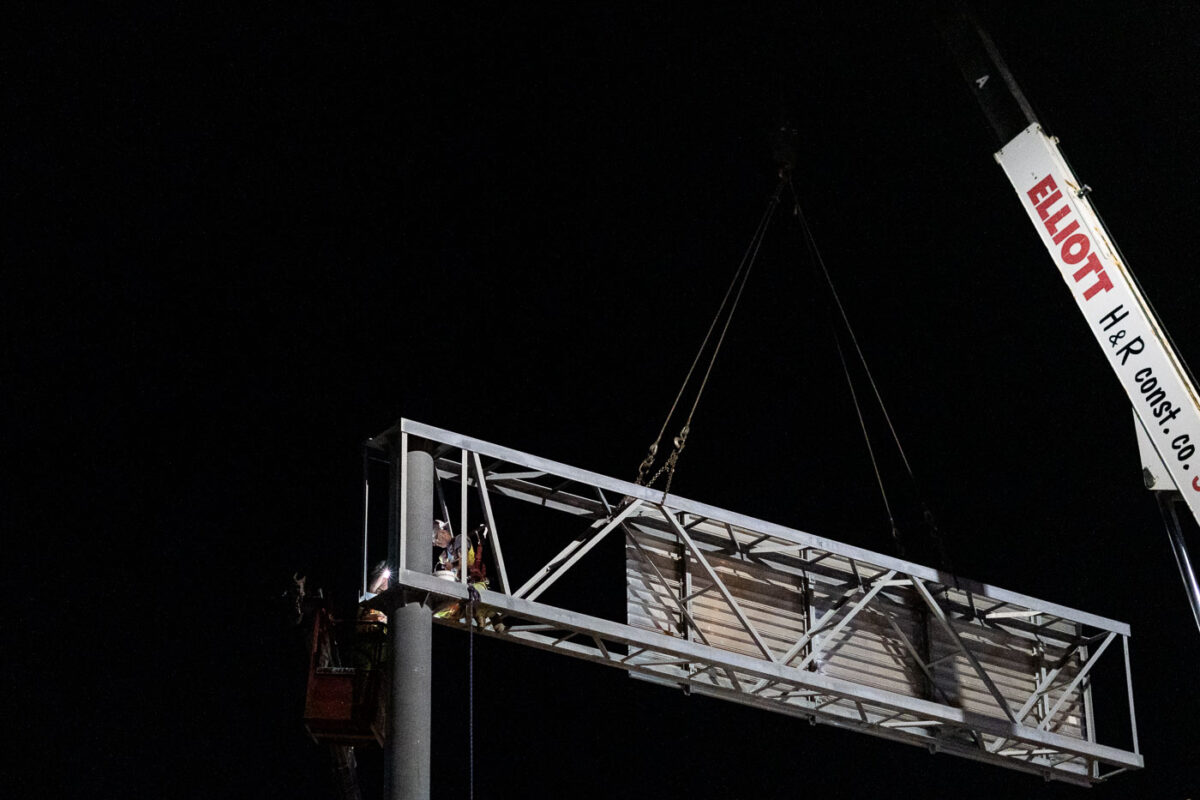 Overhead Sign Structure Installation at Night