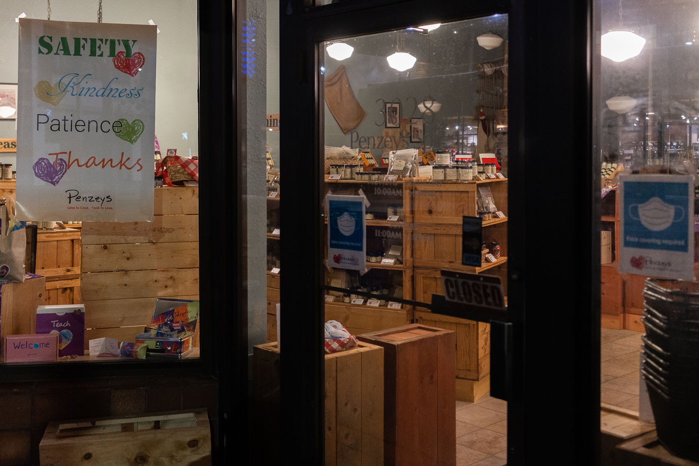 The Penzey's Spices storefront in Uptown Minneapolis displays a "CLOSED" sign and a banner promoting "Safety, Kindness, Patience, Thanks."