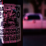 A poster stuck to a street poll in Minneapolis referencing the burning of the third precinct in May 2020.