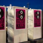 Poster pasted to electrical boxes on the Midtown Greenway in Minneapolis.