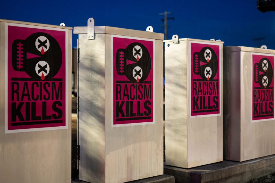 Racism Kills posters on Minneapolis Midtown Greenway electrical boxes