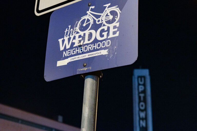 The Wedge Neighborhood Sign, Lowry Hill East, Minneapolis 2 The Wedge neighborhood sign in Lowry Hill East, Minneapolis, features a bicycle motif and the website thewedge.org, indicating community focus on cycling.