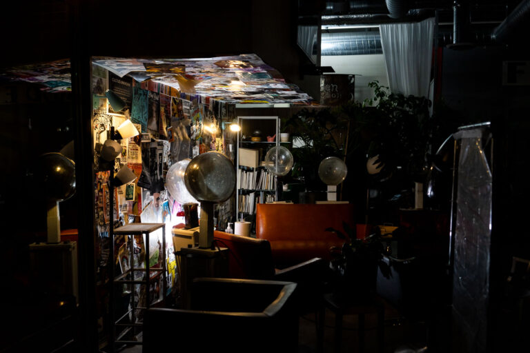 Uptown Minneapolis Hair Salon Interior 2 Interior of a hair salon in Uptown Minneapolis, featuring vintage hair dryers, posters, and a retro aesthetic.