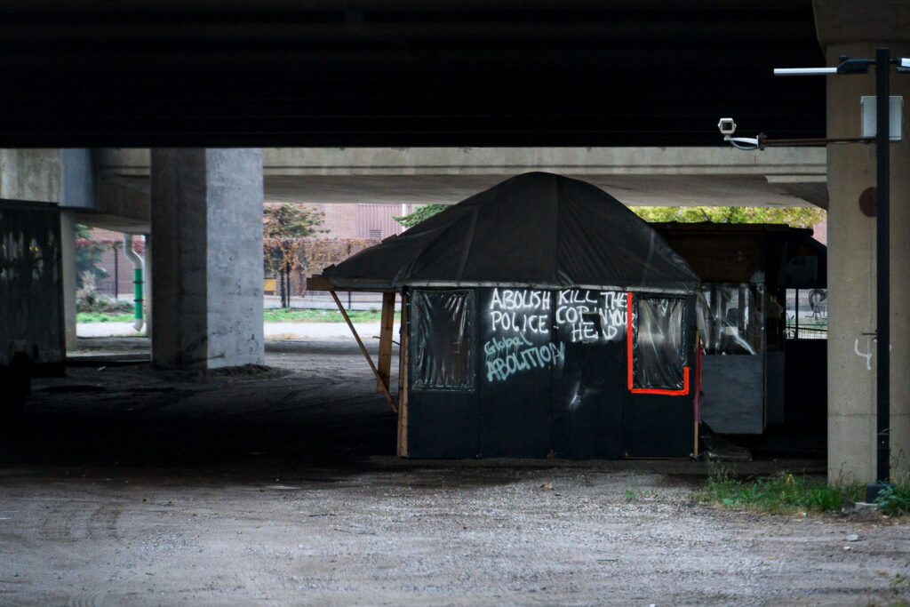 Barricade shacks that were removed from Geroge Floyd Square on June 3rd still sit under a freeway in an impound lot near downtown Minneapolis.