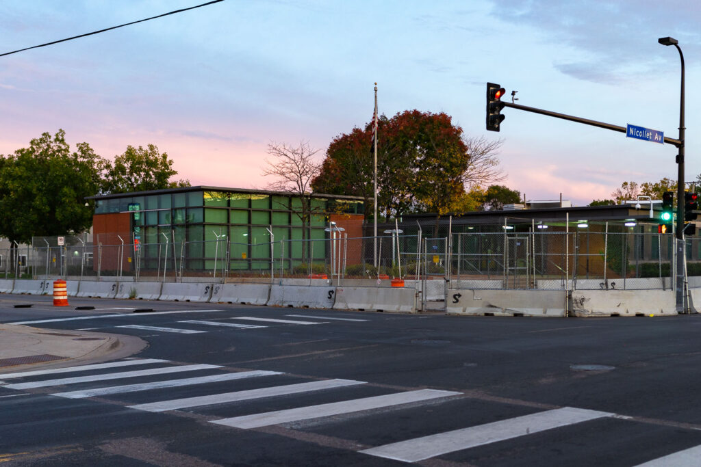 The Minneapolis Police Fifth Precinct with security fencing.