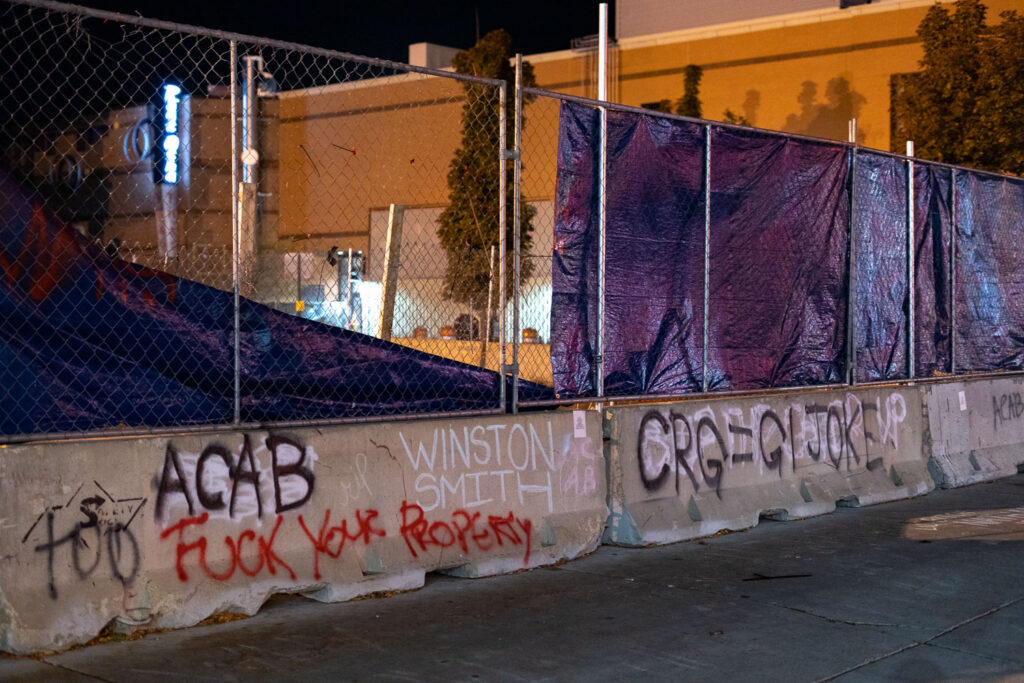 ACAB, Fuck Your Property, CRG=GI JOKE written on barricades outside the parking ramp Winston Smith was killed by law enforcement in June 2021.