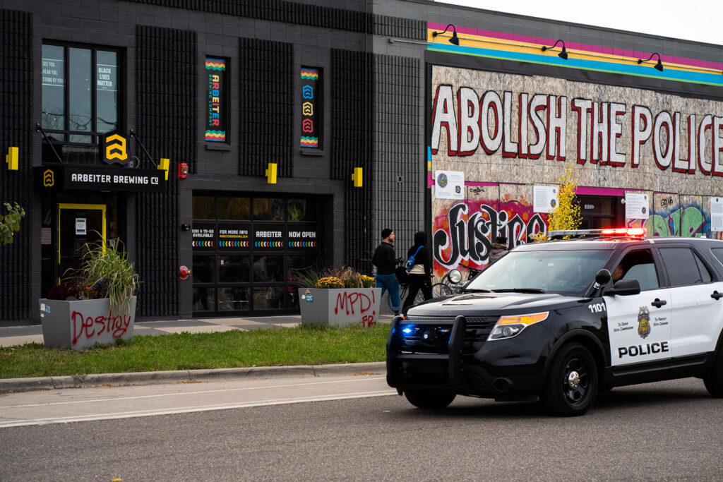 A Minneapolis Police squad drives down Minnehaha Ave as Open Streets finishes up.