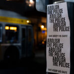 Posters hanging on a street pole in Uptown Minneapolis. They read “Abolish the police” “We keep us safe”. The posters hang outside the parking ramp that Winston Smith was killed at in June by federal law enforcement.