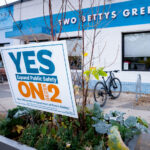 A "YES ON 2" yard sign on Minnehaha Ave during Open Streets.