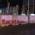 Graffiti on concrete barriers around the parking garage where Winston Smith was killed on June 3rd, 2021 by law enforcement.