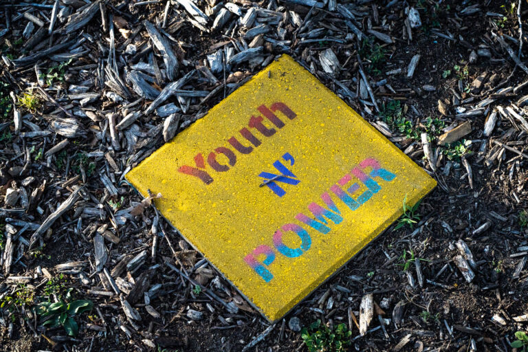 George Floyd Square Youth N Power 2 "Youth N' Power" written on a stone near the Say Their Names Memorial at George Floyd Square.