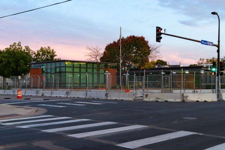 Minneapolis Police Fifth Precinct fencing and barricades 4 The Minneapolis Police Fifth Precinct with security fencing and concrete barricades surrounding it.