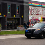 A Minneapolis Police squad drives down Minnehaha Ave as Open Streets finishes up.
