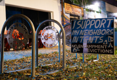 "I support my neighbors in tents. No encampment evictions" yard sign on Minnehaha Avenue.