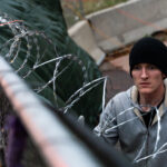 Security installs razor wire on top of fencing around the parking garage at Lake & Girard where Winston Smith was killed on June 3rd, 2021. This comes the day before the County Attorney announces they will not be charging the unidentified officers who shot and killed Winston Smith as part of a federal task force.