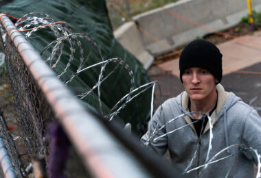 Security installs razor wire on top of fencing around the parking garage at Lake & Girard where Winston Smith was killed on June 3rd, 2021. This comes the day before the County Attorney announces they will not be charging the unidentified officers who shot and killed Winston Smith as part of a federal task force.