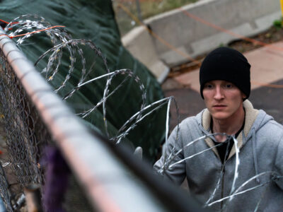 Private security installing razor wire